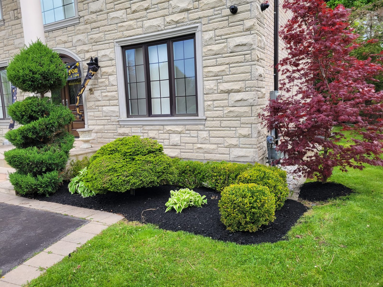 Mill Pond neighbourhood front garden with mature perennial beds and heritage streetscape