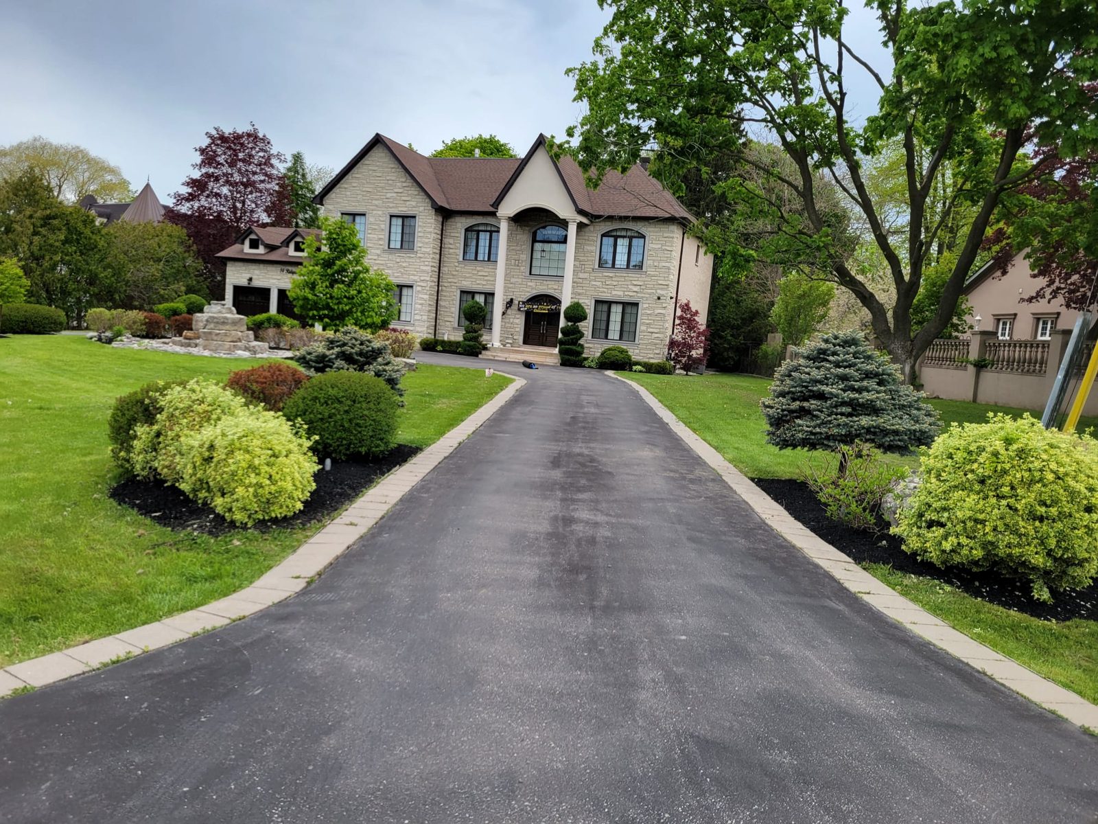 Striped freshly mowed lawn on a large residential property