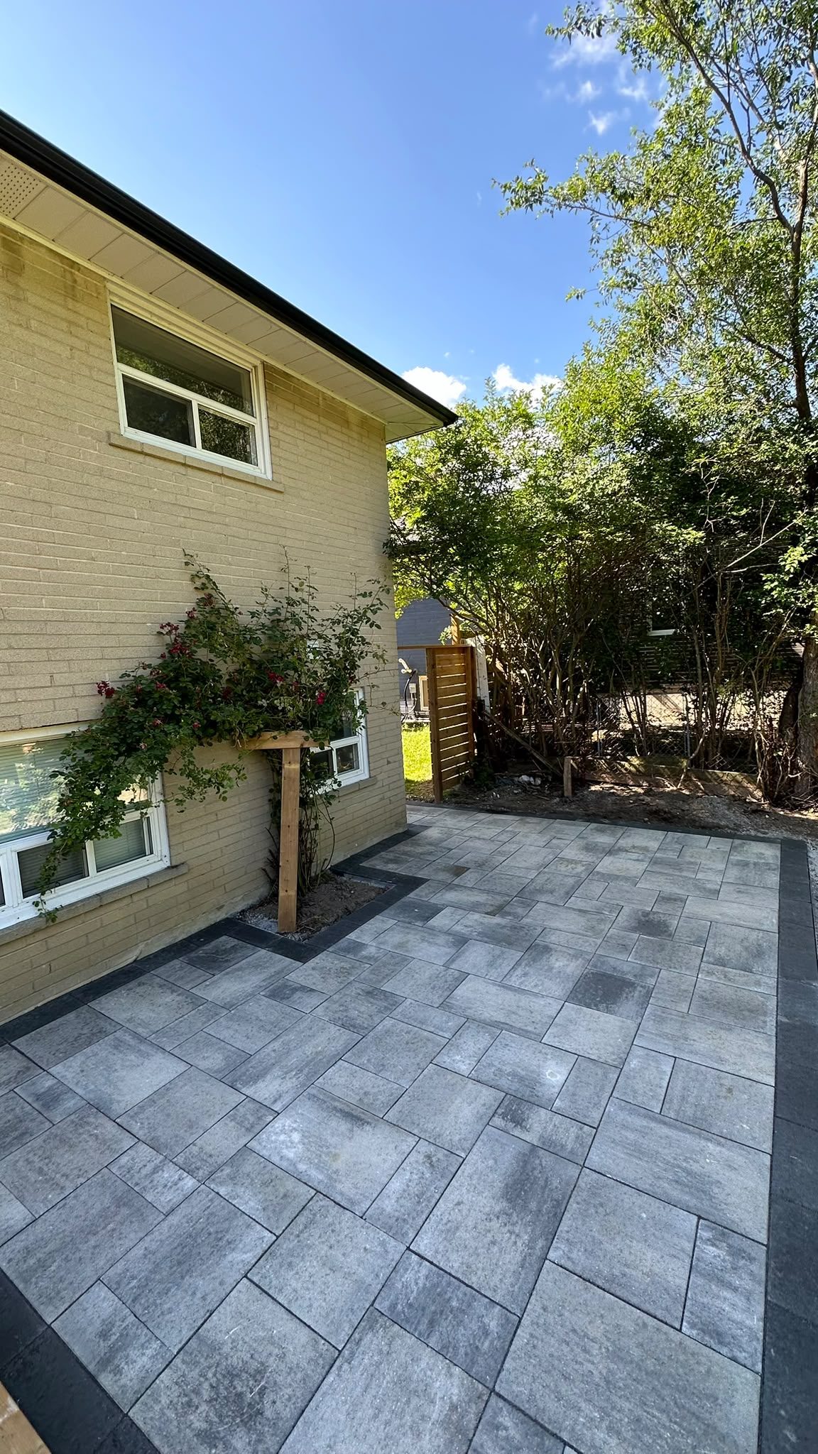 Backyard patio with fire pit and landscaping